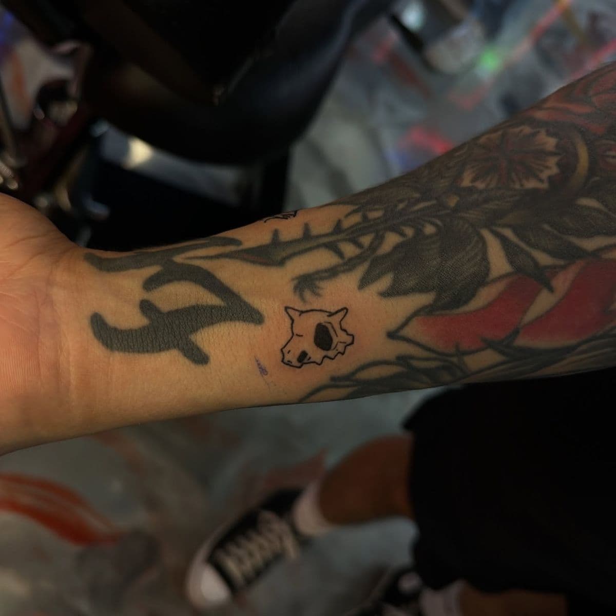Cactus and cat skull blackwork on forearm