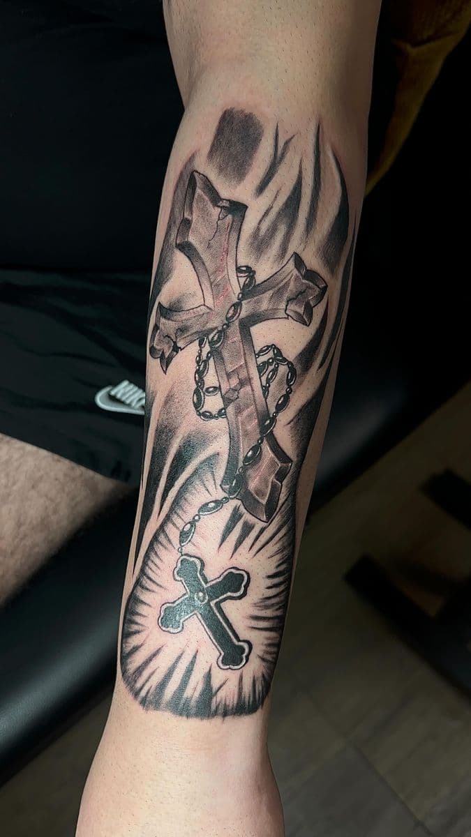 Cross and rosary chain black and grey realism forearm