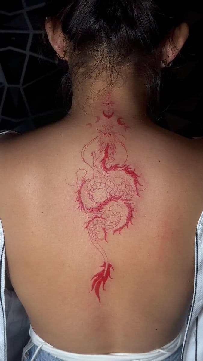 Red ink dragon coiling up the spine