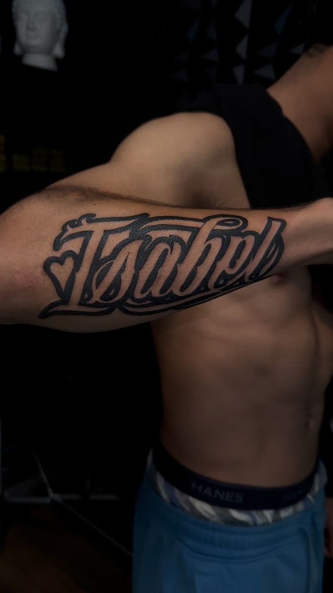 Isaiah chicano lettering bold forearm piece