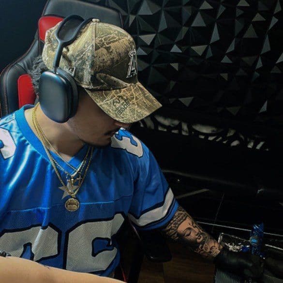 Buddha tattooing in the studio